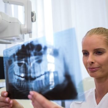 dentist-looking-dental-x-ray-plate (1)
